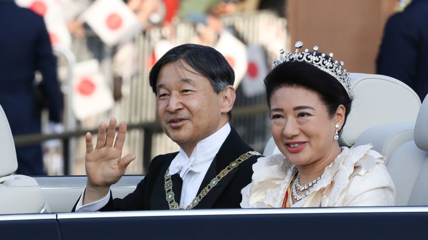 TOKYO, JAPAN - NOVEMBER 10: Emperor Naruhito and Empress Masako wave from their car during the imperial parade for enthronement of Emperor Naruhito on November 10, 2019 in Tokyo, Japan. Japan's Emperor Naruhito and Empress Masako paraded in a convertible sedan along a 4.6-kilometer route in Tokyo from the Imperial Palace to their residence in the Akasaka Estate to mark the enthronement. (Photo by Takashi Aoyama/Getty Images)