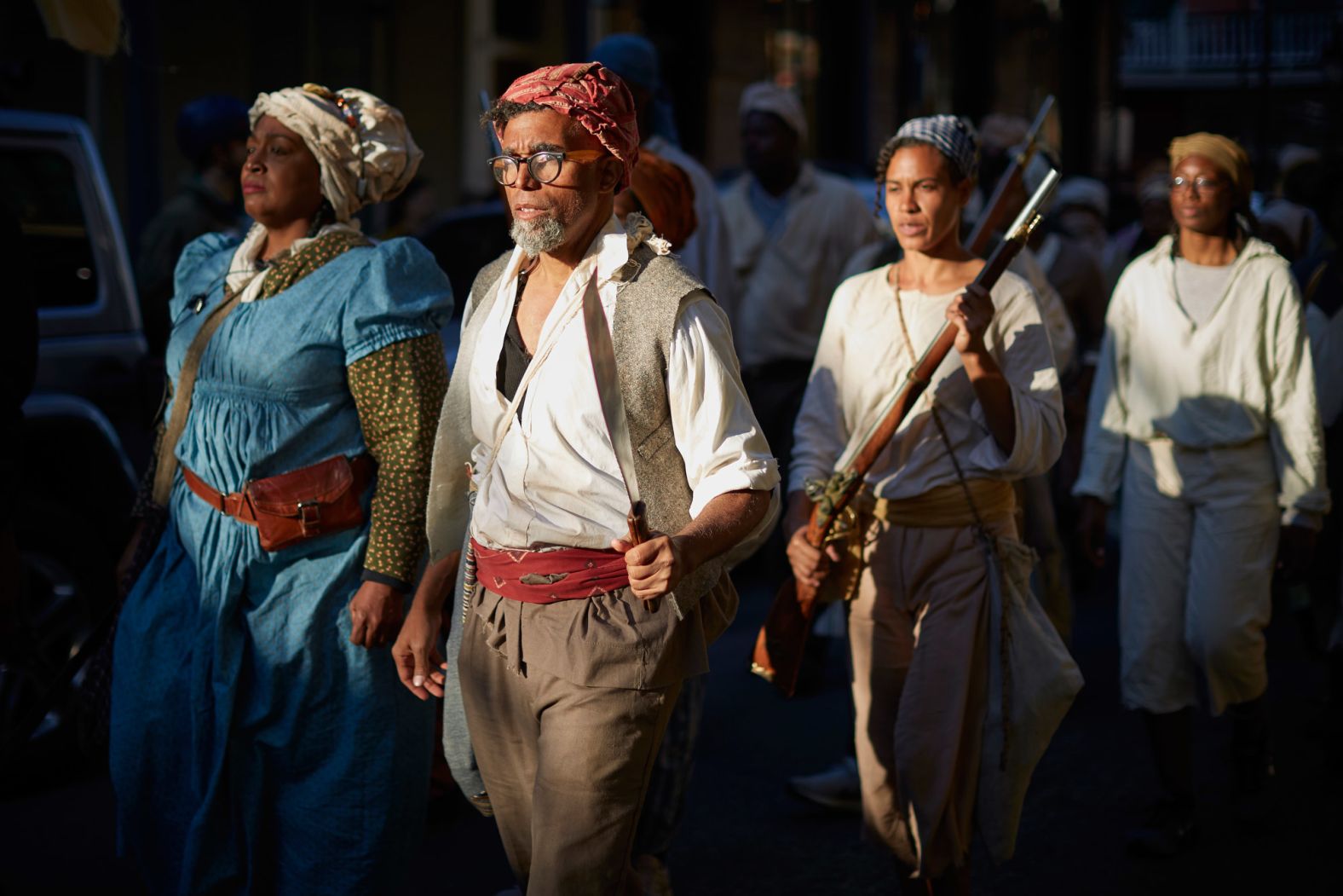 Artist Dread Scott, second from left, marches through New Orleans. Scott spent six years planning the march in conjunction with other artists, historians and community members.