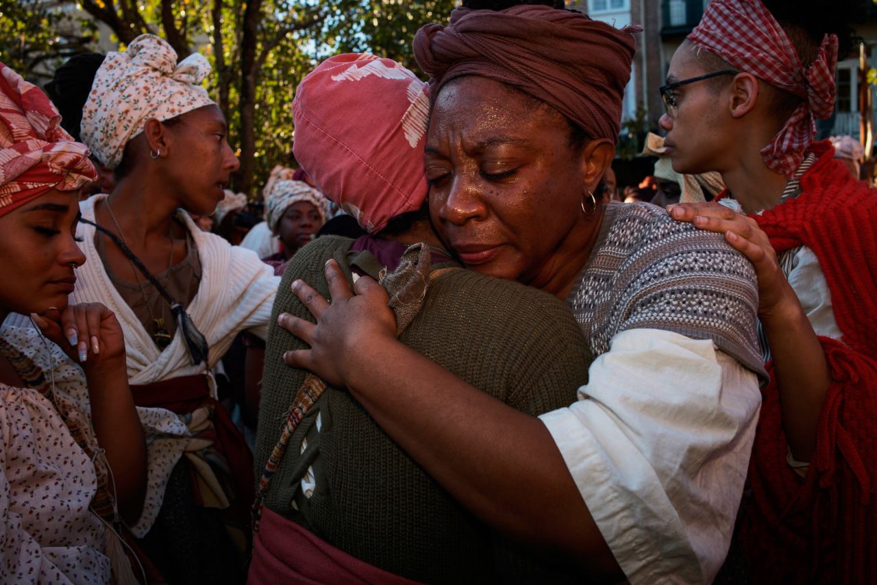 Aretha Campbell of Brooklyn, New York, is comforted after becoming emotional in New Orleans. The 1811 rebellion never reached the city, but in this recreation the second day examined what could have happened if it had.