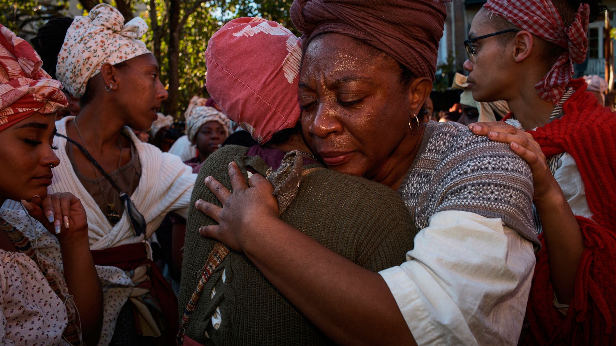 Aretha Campbell of Brooklyn, New York, is comforted after becoming emotional in New Orleans. The 1811 rebellion never reached the city, but in this recreation the second day examined what could have happened if it had.