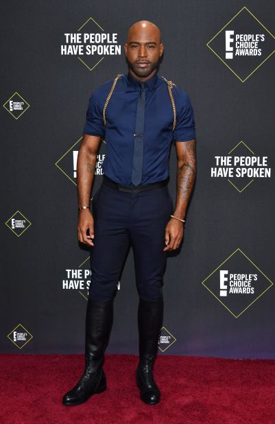 "Queer Eye" star Karamo Brown accessorized his dapper outfit with a thin gold harness.