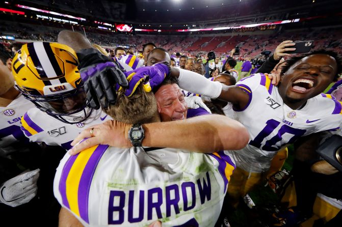 LSU Tigers quarterback Joe Burrow celebrates with head coach Ed Orgeron after defeating the Alabama Crimson Tide 46-41 at Bryant-Denny Stadium on November 09 in Tuscaloosa, Alabama.