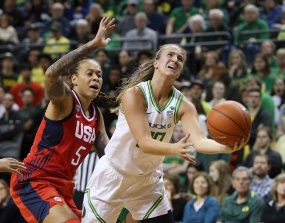 Oregon's Sabrina Ionescu, right, goes up for a shot ahead of United States' Seimone Augustus, left, during the second quarter of an exhibition basketball game in Eugene, Oregon, November 9. Oregon beat the women's national team 93-86, resulting in the second loss to a college team in the Americans' program history.