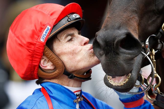 Craig Williams celebrates alongside racehorse Soothing after winning race 5 the G.H. Mumm Century Stakes during 2019 Oaks Day, November 07 in Melbourne, Australia.