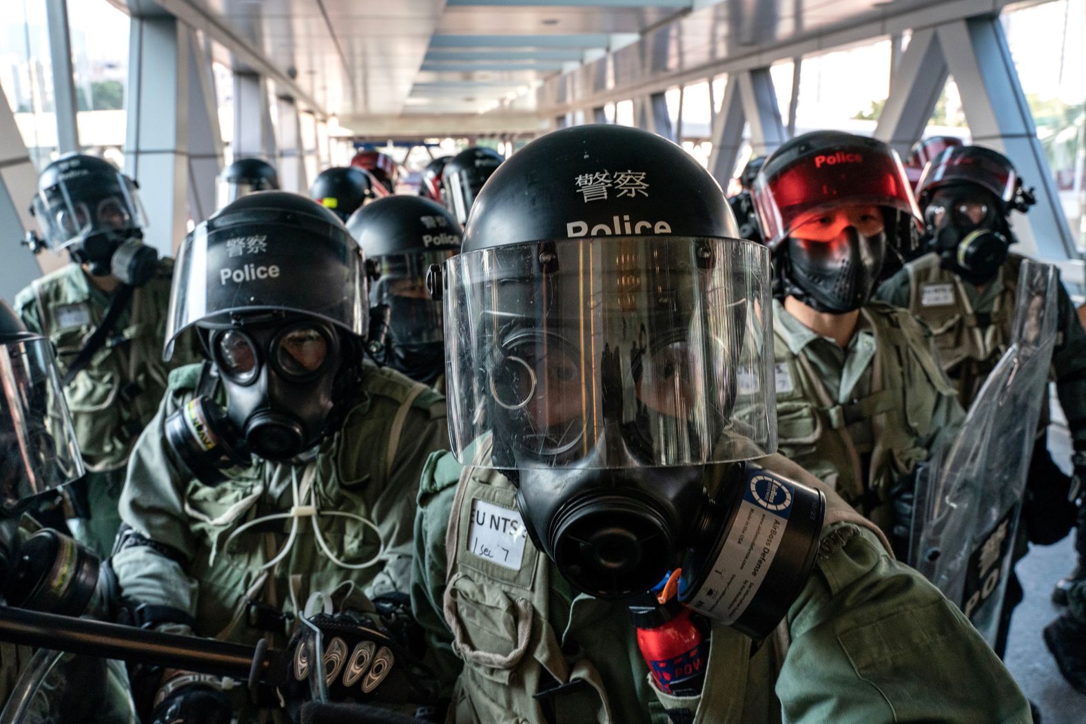 Riot police face off with protesters at an entrance of a shopping mall during a demonstration on November 10.