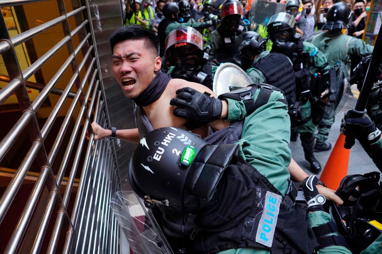 A protester is detained in the Central District of Hong Kong on November 11.