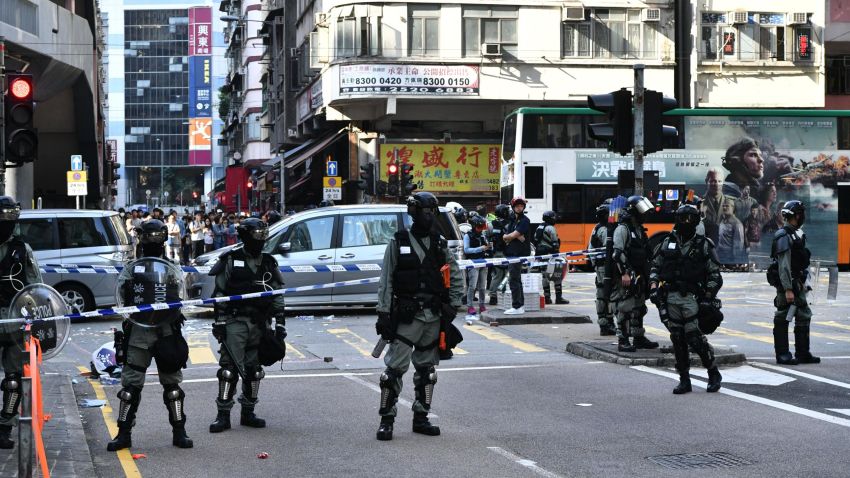 Police officers cordon off an area where pro-democracy protesters were shots by a policeman in Hong Kong on November 11, 2019. - A Hong Kong police officer shot at masked protesters -- hitting at least one in the torso -- during clashes broadcast live on Facebook, as the city's rush hour was interrupted by protests. (Photo by Anthony WALLACE / AFP) (Photo by ANTHONY WALLACE/AFP via Getty Images)