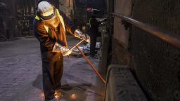 An employee takes a sample of steel for testing at Liberty Steel's Thrybergh mill in Rotherham, U.K., on Thursday, July 4, 2019. The largest steel industry group in China has urged the government to maintain order in the global iron ore market after prices surged to a five-year high following a supply squeeze, saying that its requested authorities look into the gains. Photographer: Chris Ratcliffe/Bloomberg via Getty Images