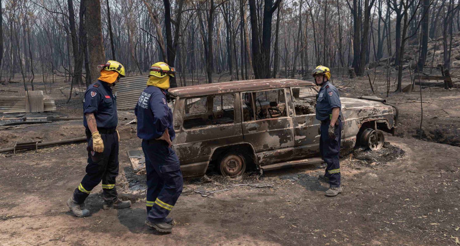 A fire and rescue team inspects damage around the village of Torrington on November 11.