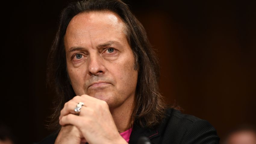 T-Mobile CEO John Legere prepares to testify at the Senate Judiciary Committee's Subcommittee on Antitrust, Competition Policy and Consumer Rights hearing on the proposed merger of T-Mobile and Sprint in the Dirksen Senate Office Building on Capitol Hill in Washington, DC, on June 27, 2018.   (Photo credit should read MANDEL NGAN/AFP via Getty Images)