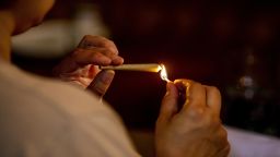 A customer lights a joint at the Lowell Cafe, a new cannabis lounge in West Hollywood, California, U.S., on Tuesday, Oct. 1, 2019. America's first cafe to allow the consumption of cannabis offers an extension to the market, where sales are largely confined to dispensaries and online orders, and tests the appetite for a more open and public consumption of a product that's still illegal in many jurisdictions. Photographer: Kyle Grillot/Bloomberg via Getty Images