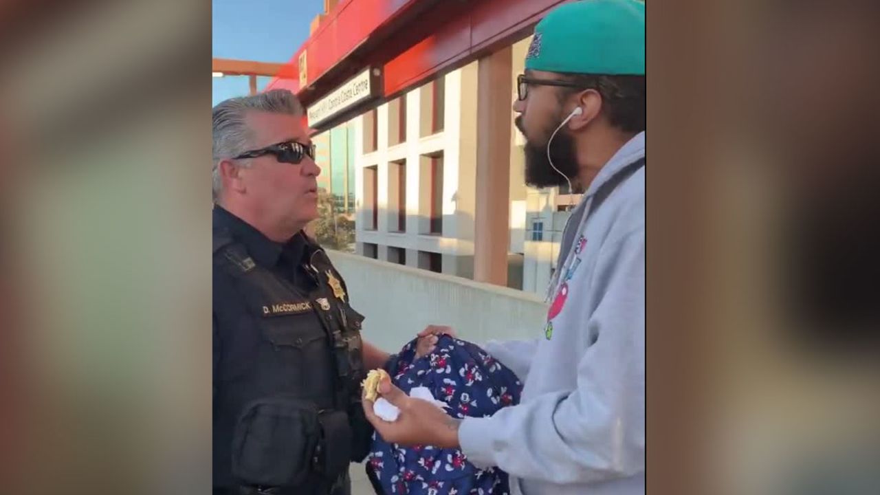 Police detain a man for eating a sandwich on a San Francisco BART