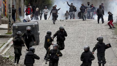 Supporters of former President Evo Morales clash with police in La Paz, Bolivia, on Monday.