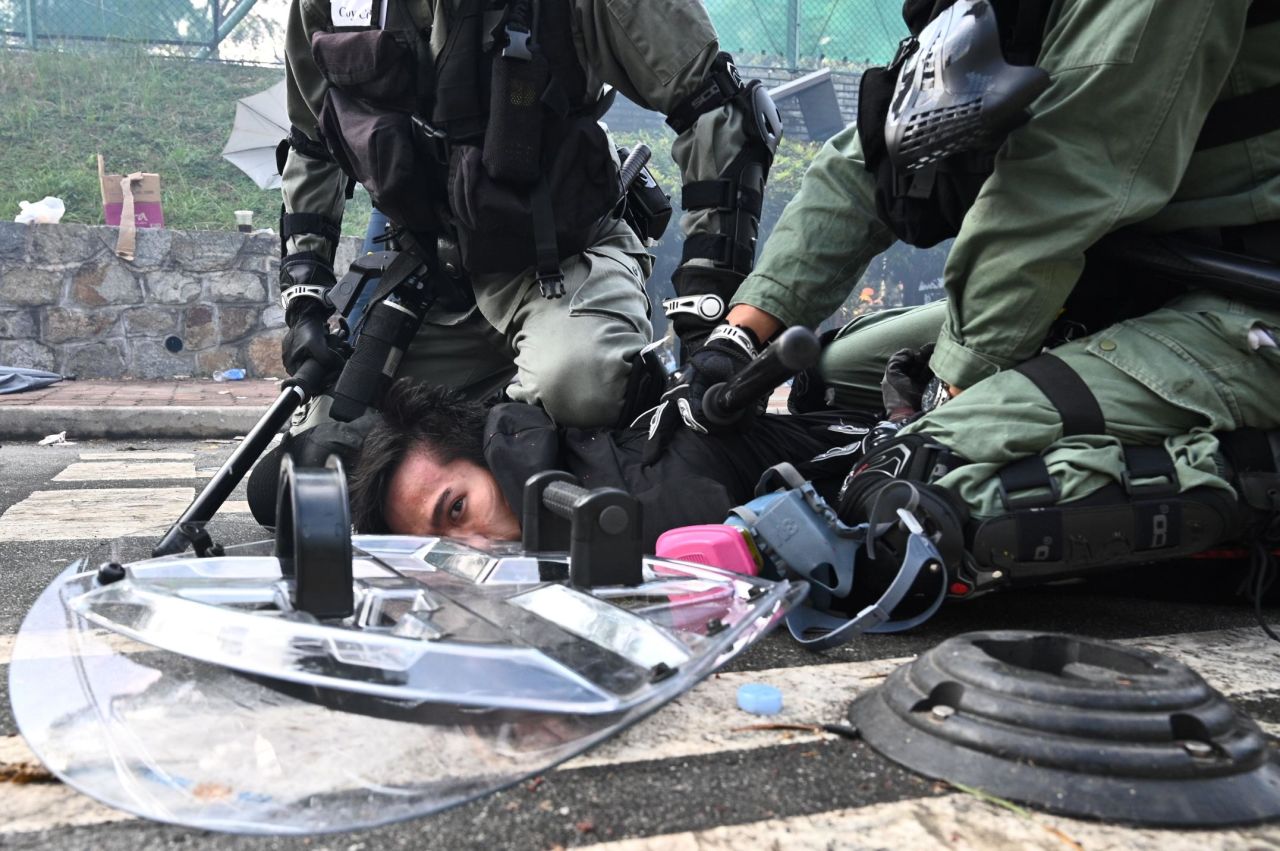 A man is detained during a protest at the Chinese University of Hong Kong on November 12.
