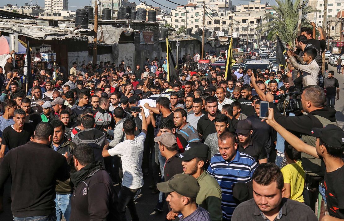 Mourners carry the body of Baha Abu Al-Ata during his funeral in Gaza City on November 12. 