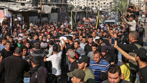 Mourners carry the body of Baha Abu Al-Ata during his funeral in Gaza City on November 12.