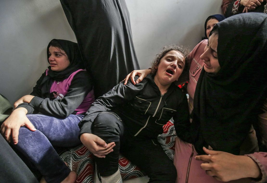 Lian (C) daughter of Baha Abu Al-Ata mourns during his funeral in Gaza City on November 12.