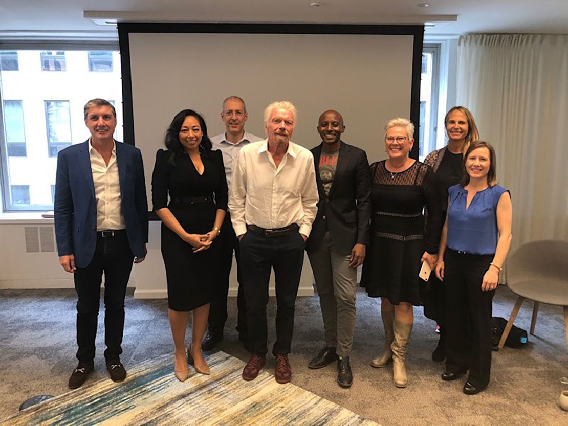 Richard Branson (center) poses with a team in Cape Town, South Africa following the launch of his new Centre for Entrepreneurship