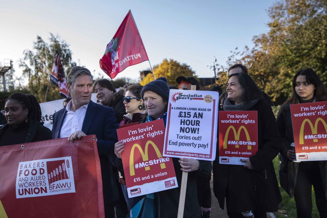 Labour MP Keir Starmer (second from left) joins union members and several McDonald's workers in protest.