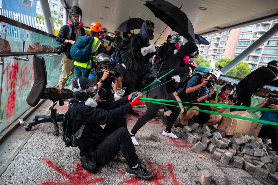 Protesters use a catapult against police during a protest Hong Kong's City University on November 12, 2019 following a day of pro-democracy protests.