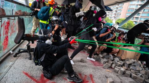 Protesters use a catapult against police during a protest Hong Kong's City University on November 12, 2019 following a day of pro-democracy protests.