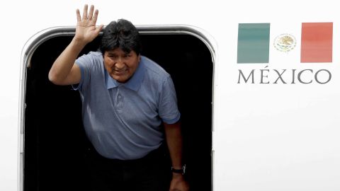Former Bolivian President Evo Morales waves upon his arrival in Mexico City on Tuesday.