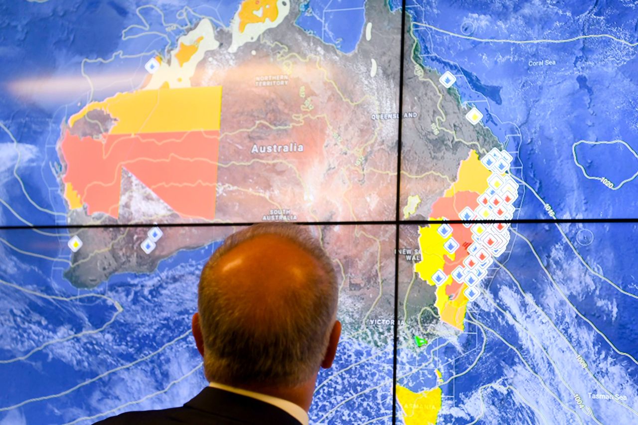 Australian Prime Minister Scott Morrison looks at a screen as he gets a briefing on the bushfire situation on November 12.