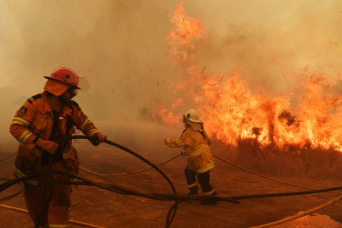 Firefighters battle a spot fire in Hillville on November 13.