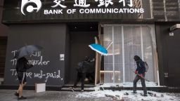 Protesters vandalise a branch of the Bank of Communications during a protest in the Central district in Hong Kong on November 13, 2019.
