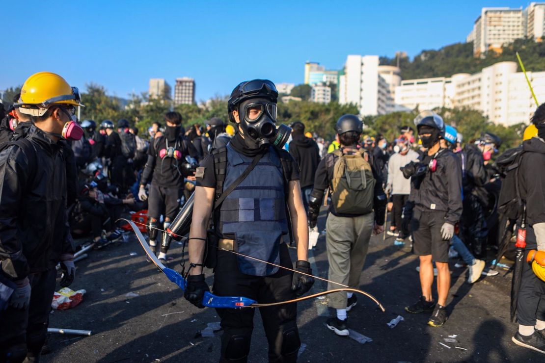 A protester armed with a bow is seen at the Chinese University of Hong Kong campus in Sha Tin on November 13, 2019. 