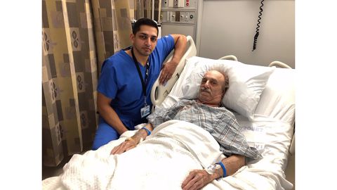 Dr. Nazir Khan and Milton Winger post for a photo after surgery.