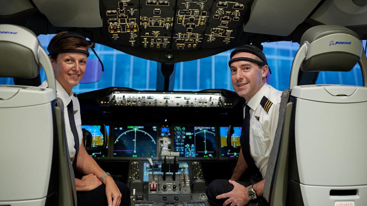 Qantas Captain Helen Trenerry and First Officer Ryan Gill demonstrate the monitors they'll wear during the flight.