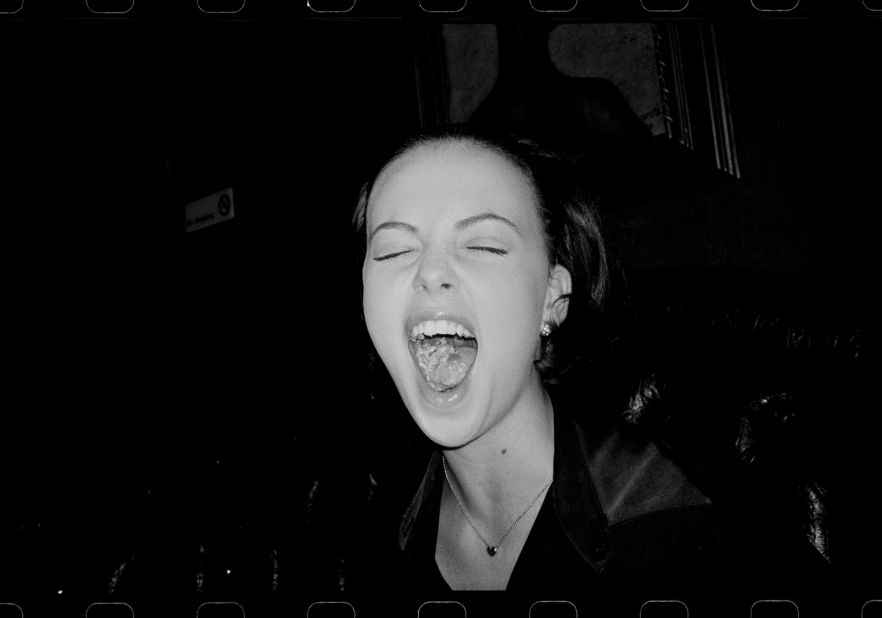 Surrounded by young rising stars, Slavin captured striking black-and-white photos of Hollywood celebrities  letting loose. Here, Slavin captured Charlize Theron.