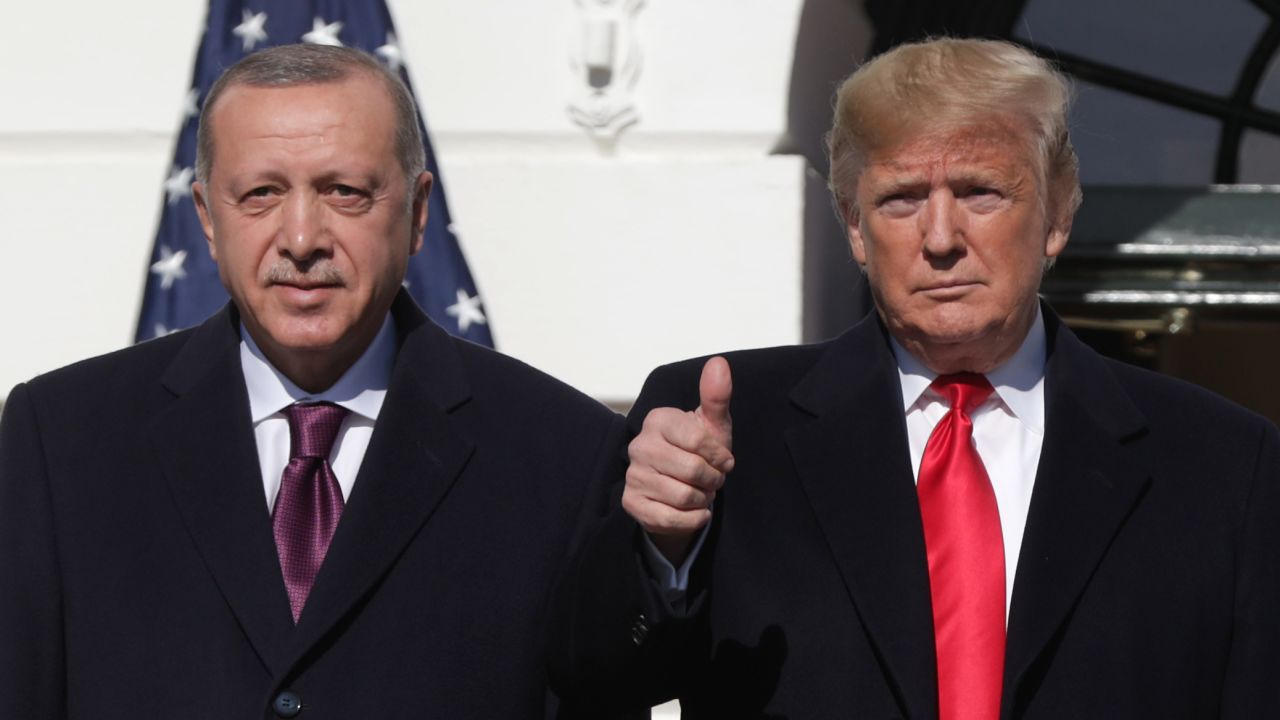 WASHINGTON, DC - NOVEMBER 13: U.S. President Donald Trump (R) gives a thumbs up will greeting Turkish President Recep Tayyip Erdogan upon his arrival at the South Portico of the White House on November 13, 2019 in Washington, DC. The two leaders will meet in the Oval Office before speaking to the media during an East Room joint news conference later in the day.  (Photo by Alex Wong/Getty Images)