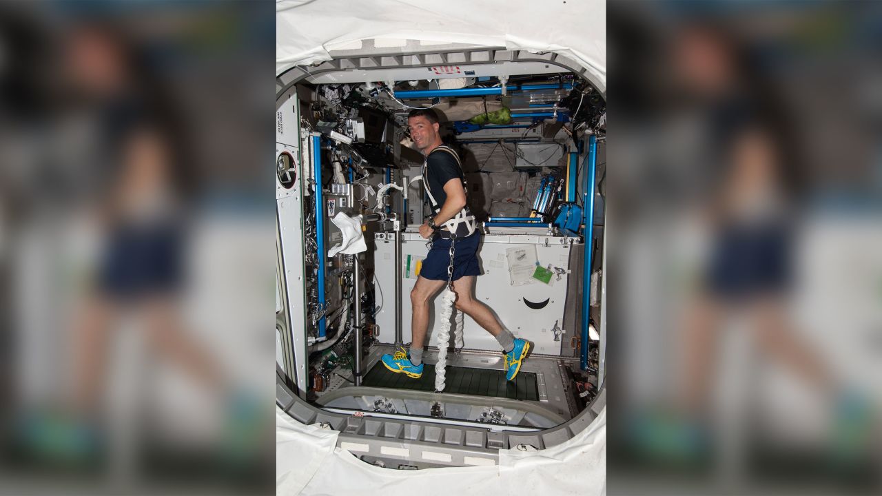 NASA astronaut Reid Wiseman works out on th ISS during Expedition 40.