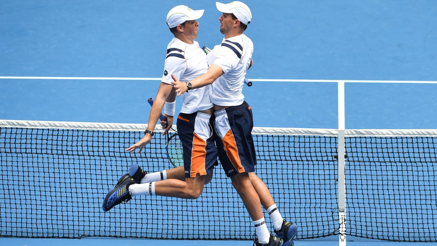 The Bryan brothers perform their trademark chest bump celebration at the 2018 Australian Open.