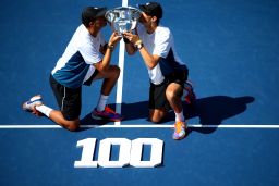The Bryan brothers celebrate winning the 2014 US Open, the 100th title of their careers.