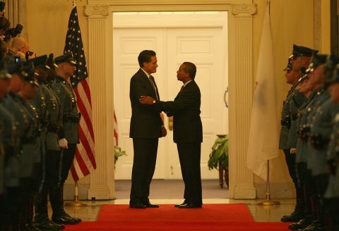 Patrick shakes hands with outgoing Gov. Mitt Romney in January 2007. Romney hadn't sought re-election. He was focusing on his presidential campaign.