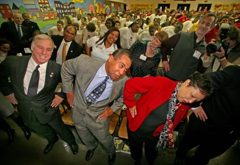 While attending Martin Luther King Jr. Day celebrations in January 2007, Patrick and his wife, Diane, participate in a physical training demonstration led by the City Year Boston Young Heroes. At left is Howard Dean, who at the time was chairman of the Democratic National Committee.