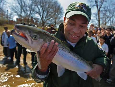 Patrick joins state wildlife officials and Boston schoolchildren who were releasing hatchery-raised fish into Jamaica Pond in April 2008.