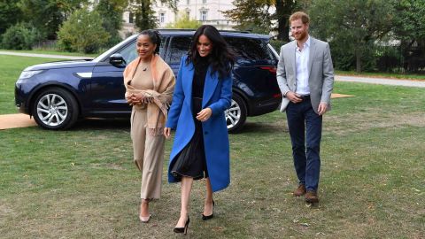 Harry and Meghan arrive at an engagement in 2018 with Meghan's mother, Doria Ragland. 