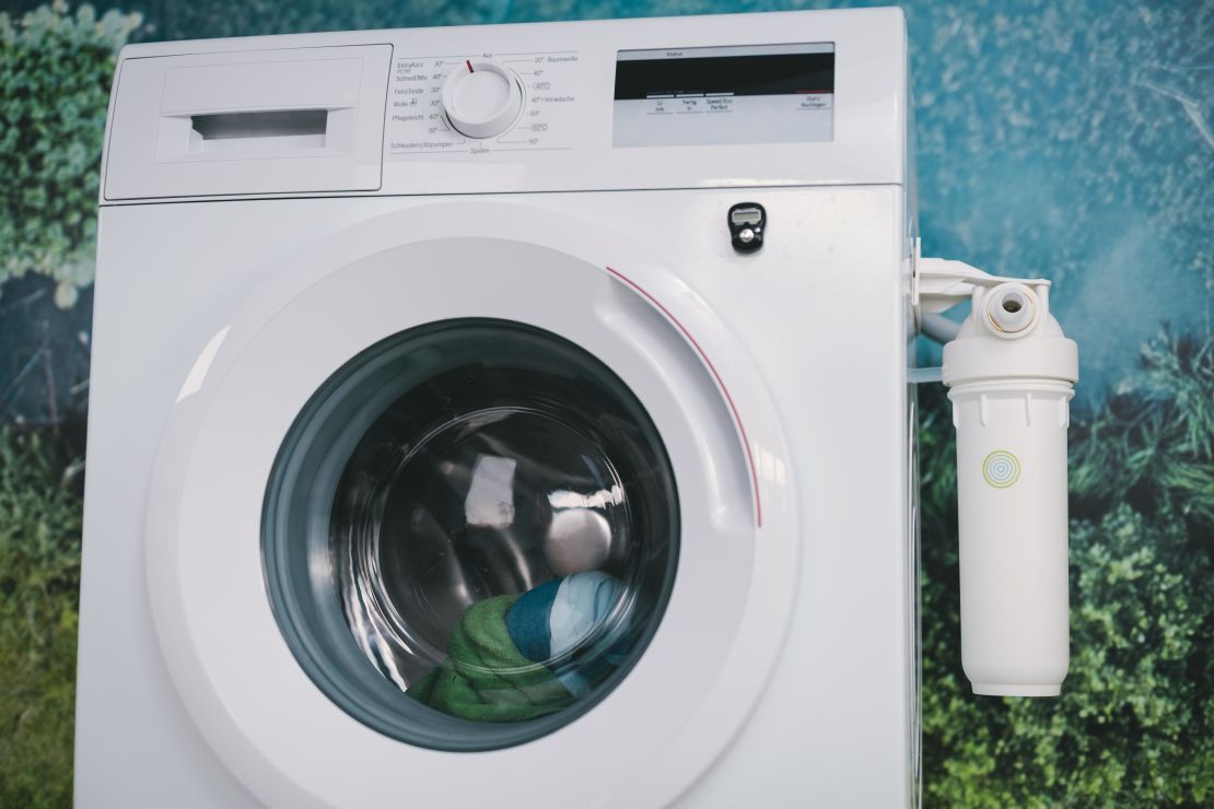 PlanetCare's filter, attached to a washing machine.