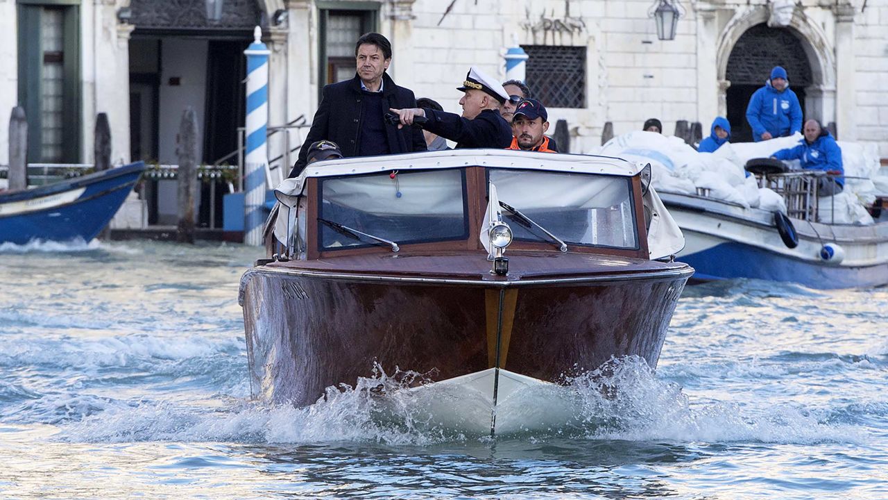 Italian Prime Minister Giuseppe Conte on a boat as he visits the flood-affected city of Venice on November 14, 2019.
