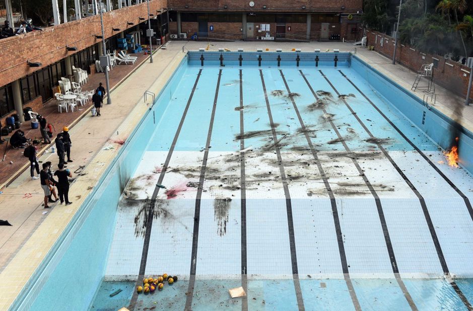 Protesters train to throw Molotov cocktails into a swimming pool on the campus of the Hong Kong Polytechnic University on November 14.