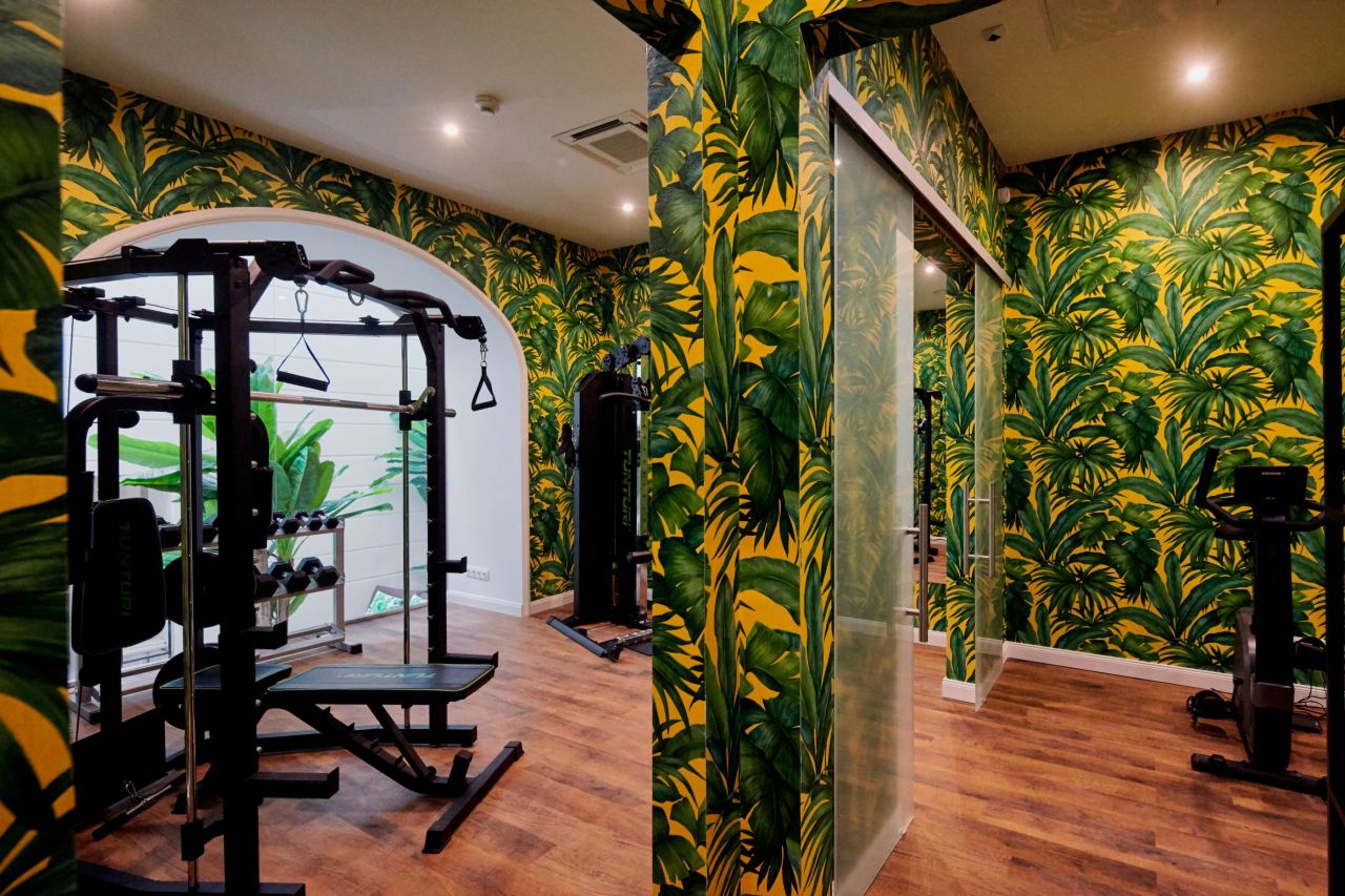 <strong>Jungle-style walls:</strong> A fitness room with various equipment is also available for guests.
