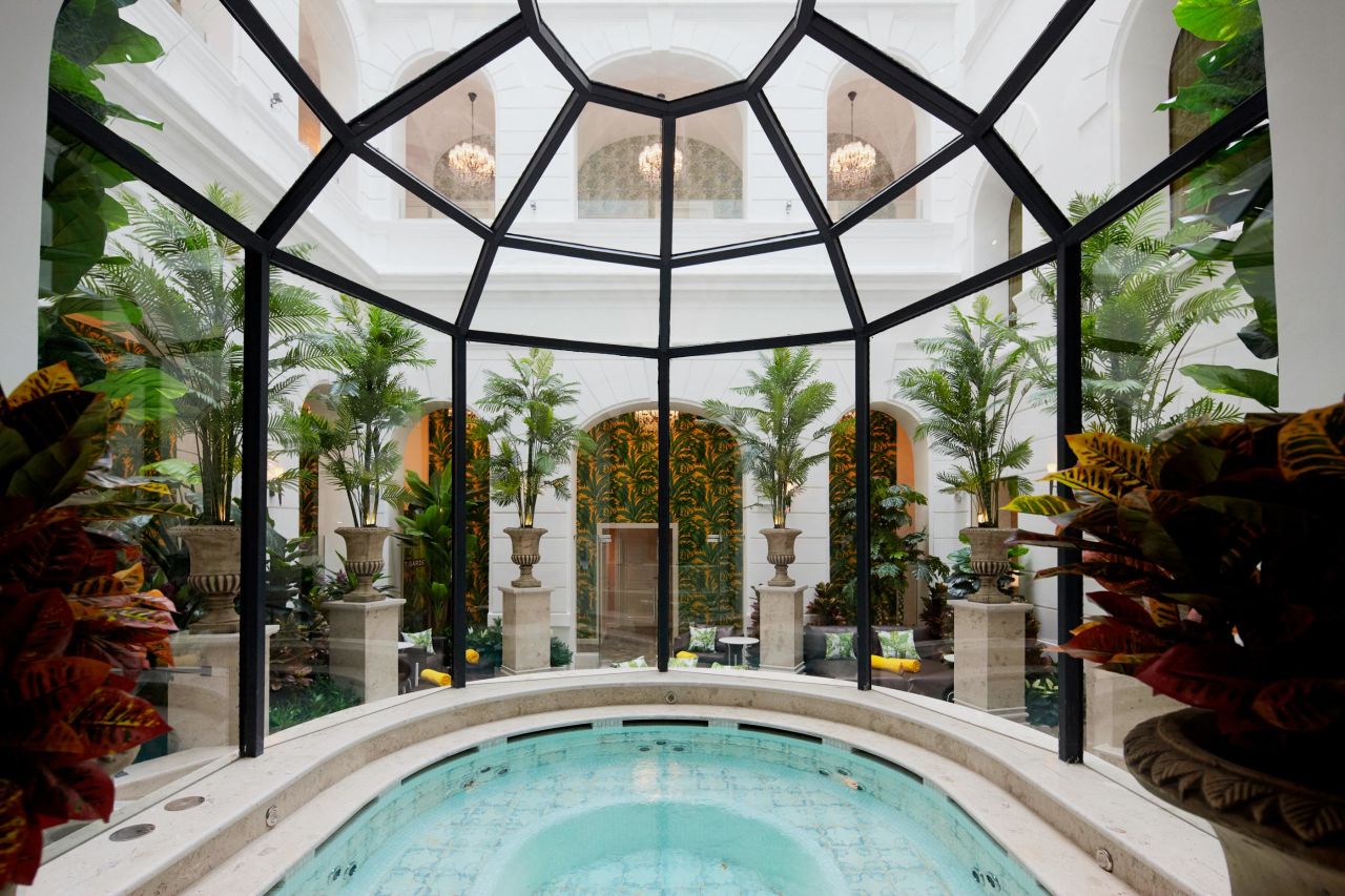 <strong>Center piece:</strong> The spa is filled with sculptures, fountains and palm trees, but the stunning hot tub is the main attraction.