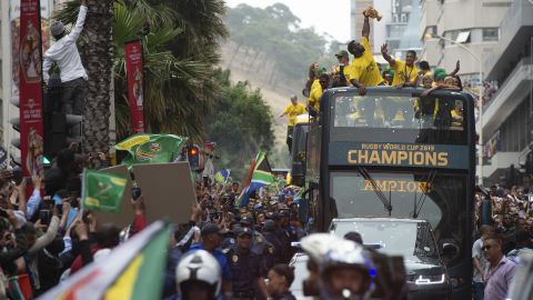 South African rugby captain Siya Kolisi holds the Webb Ellis Cup as he celebrates with thousands of Springbok fans.