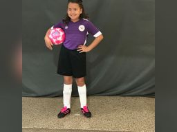 Abigail Moen stands tall in her soccer team uniform. 