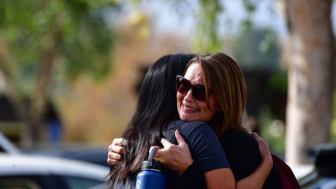 Women embrace in Central Park after a shooting at Saugus High School on November 14, 2019.