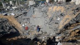 A youth stands amid the crater of a destroyed house following overnight Israeli missile strikes, in Al-Qarara, east of Khan Younis, southern Gaza Strip, on Thursday, November 14.